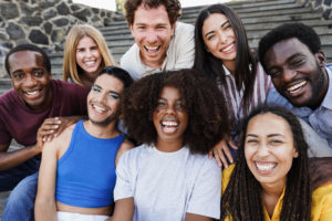 Young diverse people having fun outdoor laughing together - Diversity concept