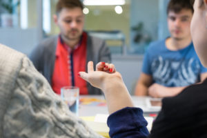 people taking part in discussion around a table