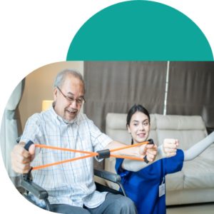 Elderly man  exercising arms with a care assitant
