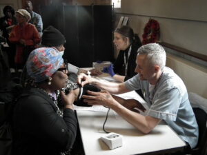 Black Lambeth woman having her blood pressure measured