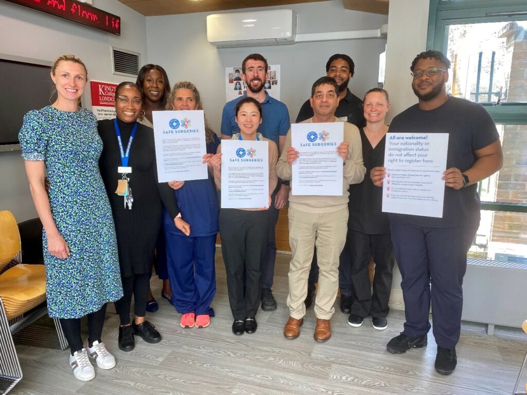 GP practice staff holding their safe Surgeries certificates