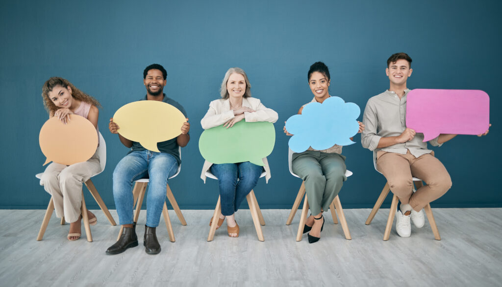 People sitting and smiling with speech bubbles