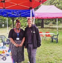 Smiling people at Green Social Prescribing Fair