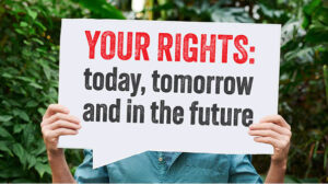 pair of hands holding a sign that says Your rights, today, tomorrow and in the future