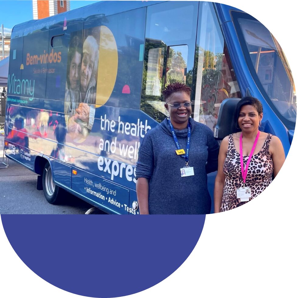 Pharmacists stand outside the Lambeth Together Health and Wellbeing Bus
