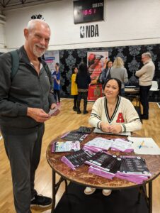 Keith, a patient attending Lambeth's MSK Day, speaking to a young lady at the event about local fitness classes at the Lambeth MSK Day March 2024