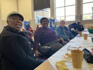 Attendees sitting together at one of the cancer screening events