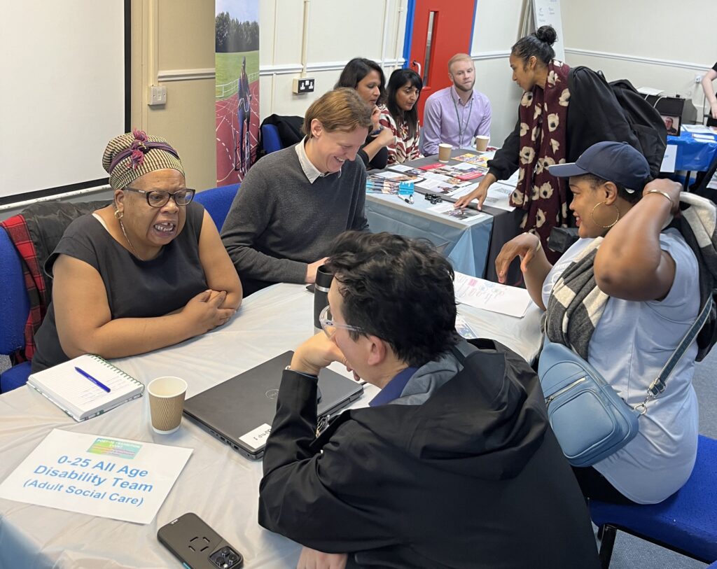 Parents and carers having discussions with representatives from the Lambeth Council's social care team and representatives from a local specialist college