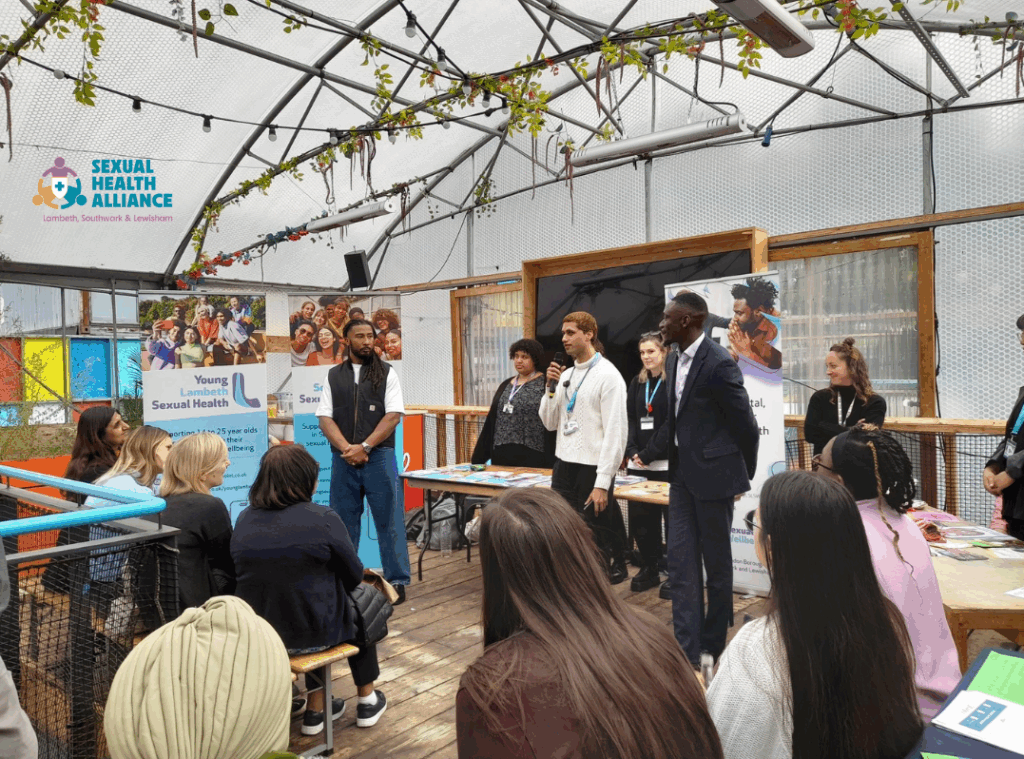 Photo of people listening to the opening speeches at the Lambeth Southwark Lewisham Sexual Health Alliance Launch Event